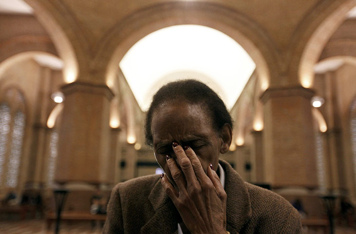 24 hours in pictures: A pilgrim prays at the Basilica of Our Lady of Aparecida in Brazil