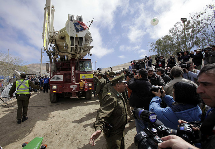 Trapped Chile miners: 11 October: Members of the media surround the T-130 drilling machine