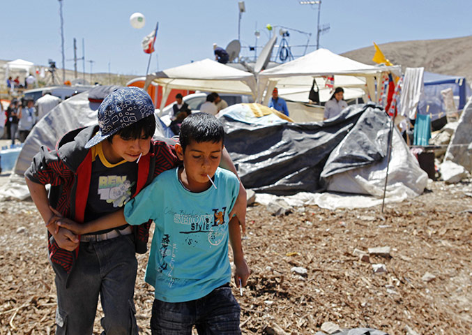 Trapped Chile miners: Kevin Castillo plays with Wilson Orostica, both relatives of trapped miners