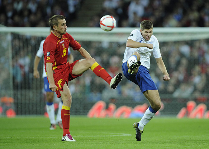 England v Montenegro 3: Milorad Pekovic and Steven Gerrard battle for the ball