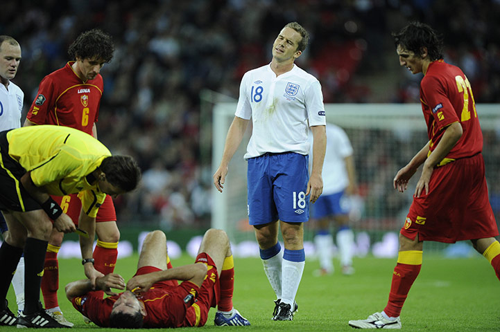 England v Montenegro 3: Kevin Davies is booked after elbowing Dzudovic