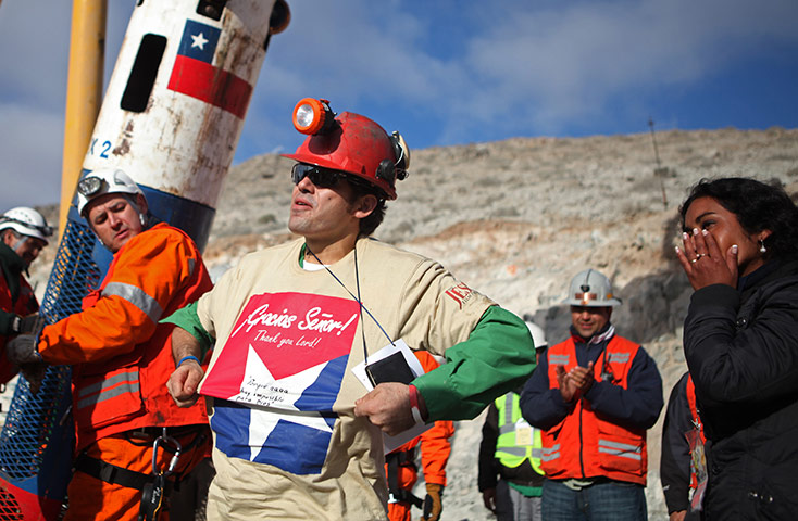 Chile miners rescue: Alex Vega gestures after being rescued from the collapsed San Jose mine