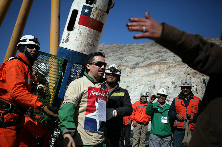 Chile miners rescue: Edison Pena, 34, becomes the twelfth miner to exit the rescue capsule