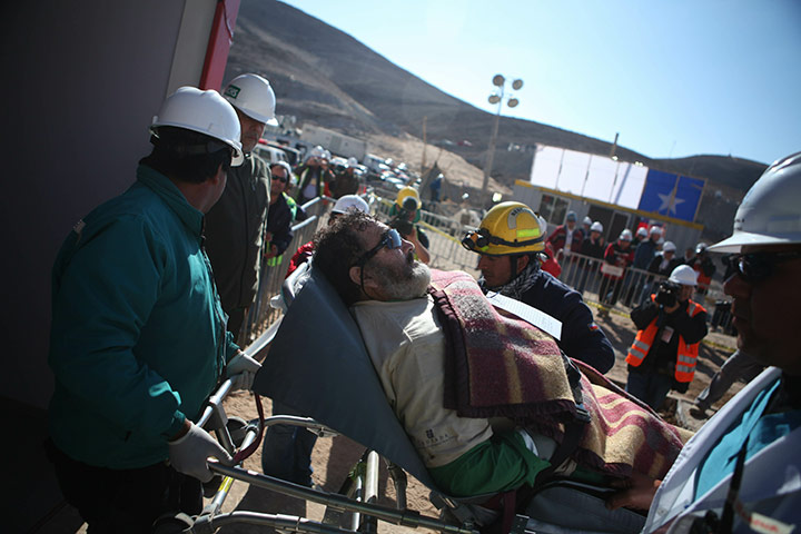 Chile miners rescue: Jorge Galleguillos is taken on a trolley to the field hospital 