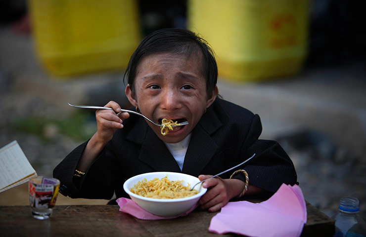 Khagendra Thapa Magar: Khagendra Thapa Magar eats noodles at his home in Pokhara