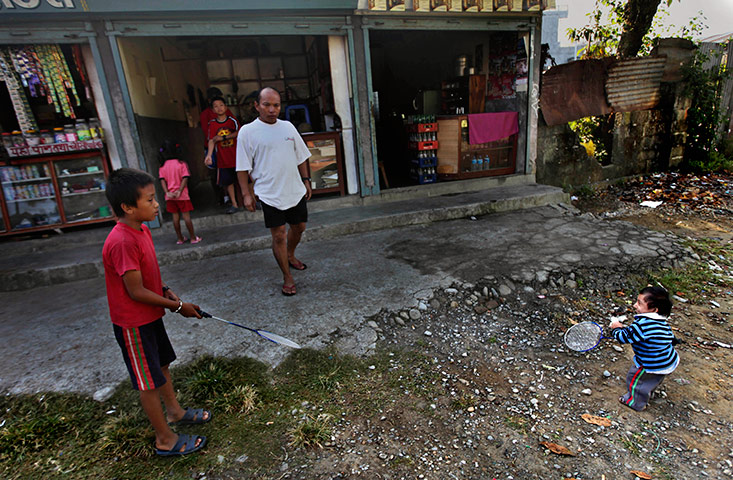 Khagendra Thapa Magar: Khagendra Thapa Magar plays badminton with a relative outside his home