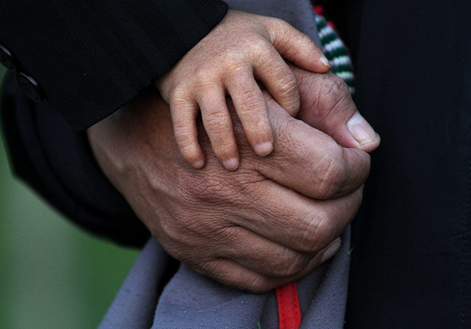 Khagendra Thapa Magar: Khagendra Thapa Magar lays his hand on the hand of Min Bhadur Thapa Magar