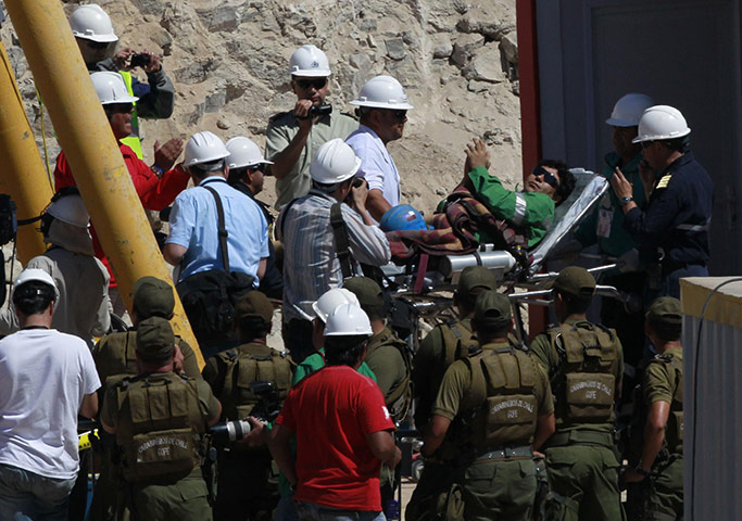Chile miners rescue: Miner Victor Zamora is wheeled to a field hospital 