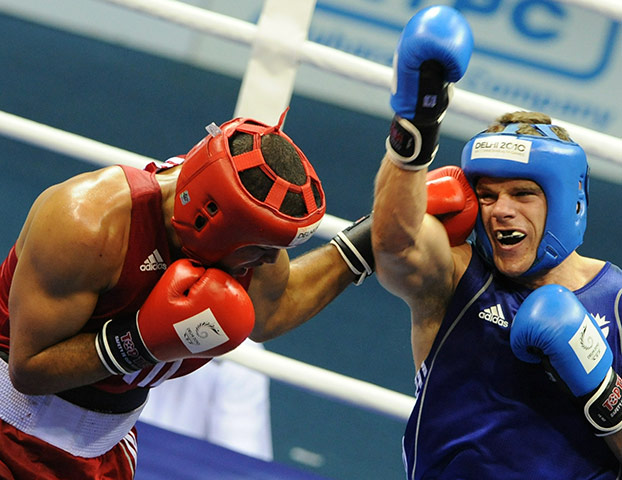 CWG Day 10: Callum Johnson of Scotland and Northern Ireland's Thomas McCarthy fight