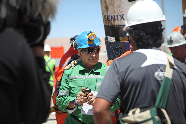 Chile rescue: Omar Reygadas holds a bible as he reaches the surface