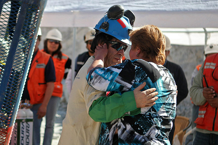 Rescued Chile miners: 21st Chilean miner Yonni Barrios hugs his wife