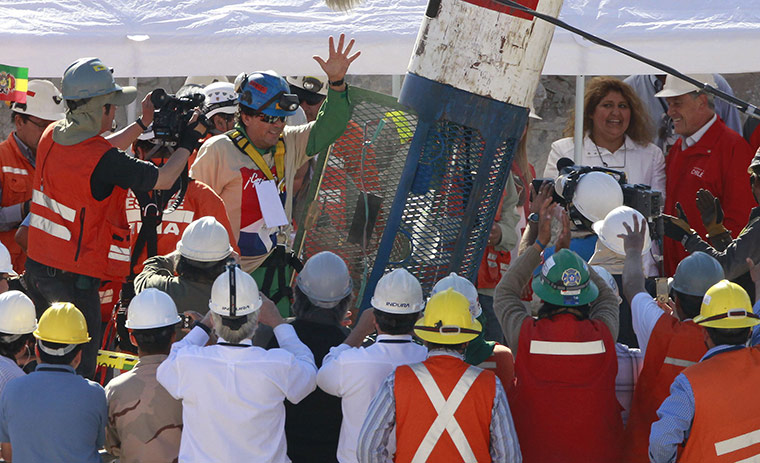 Rescued Chile miners: 22nd trapped miner Samuel Avalos waves as he emerges from the capsule