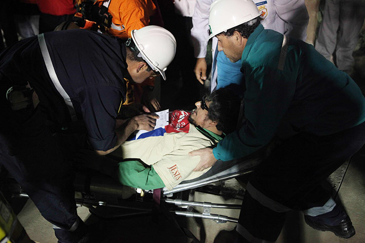 Rescued Chile miners: Juan Carlos Aguilar is placed on a stretcher, the 29th miner to be rescued 