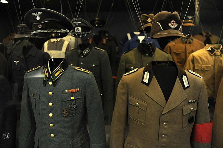 berlin hitler exhibition : Nazi uniforms hang at the German History museum