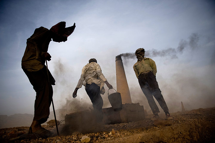 24 hours: Men work at a brick factory outside Herat city, west of Kabul, Afghanistan,