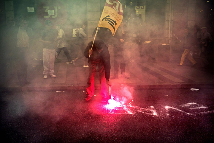 24 hours: A railway worker from state-run company SNCF uses a fumigator to write