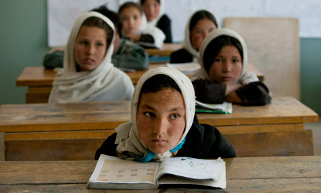 Afghan girls listen during