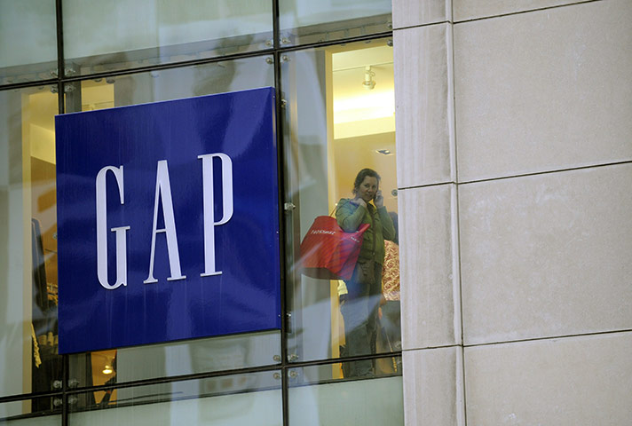 Week in Business: A woman shops at a GAP store in New York
