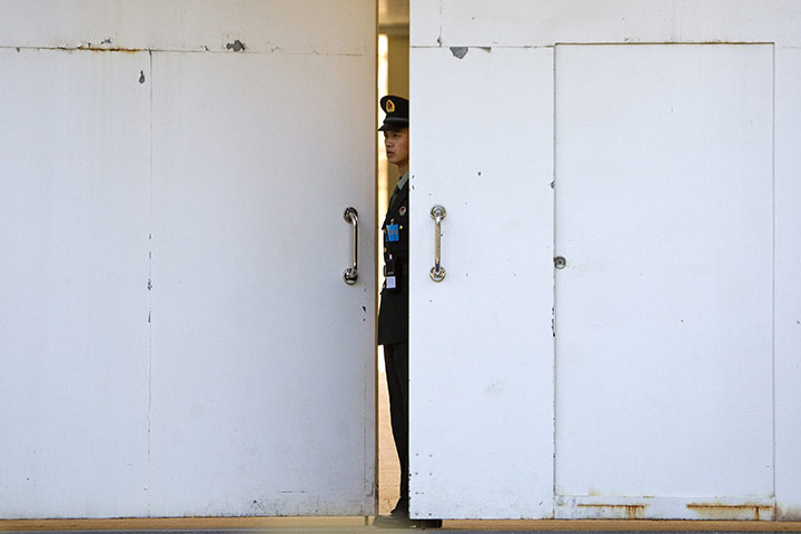 Communist Party Chinaq: A soldier guards an entrance to the military controlled Jingxi Hotel