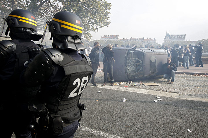 France Strike Update: An overturned car during a demonstration against retirement reforms in Lyon