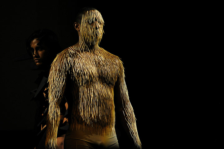 24 Hours in Pictures: A man with needles at the 5th World Meeting of Body Art in Caracas