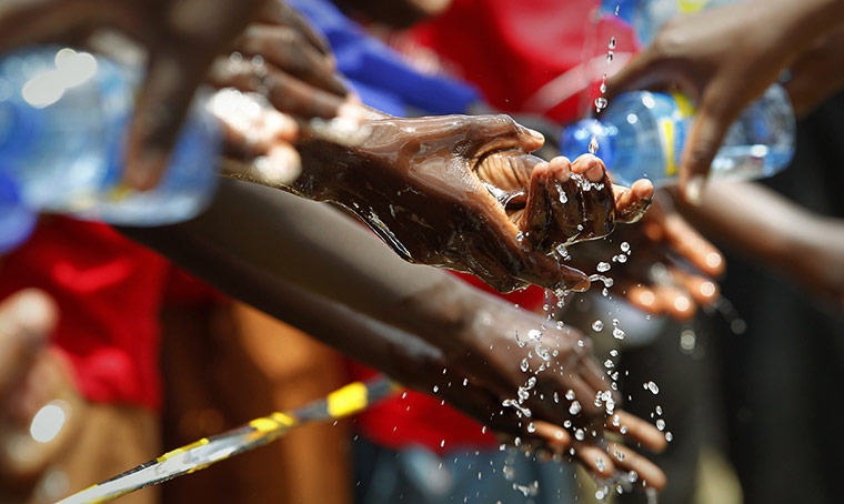 24 Hours in Pictures: Schoolchildren wash their hands on the third annual Global Handwashing Day