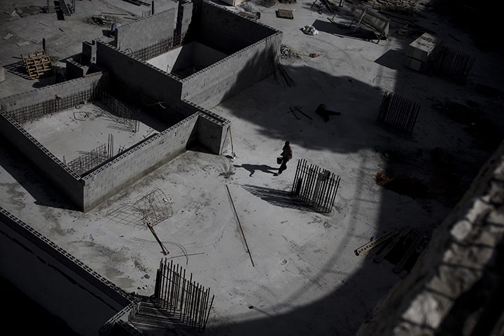 24 Hours in Pictures: A Palestinian man works on a construction site in east Jerusalem