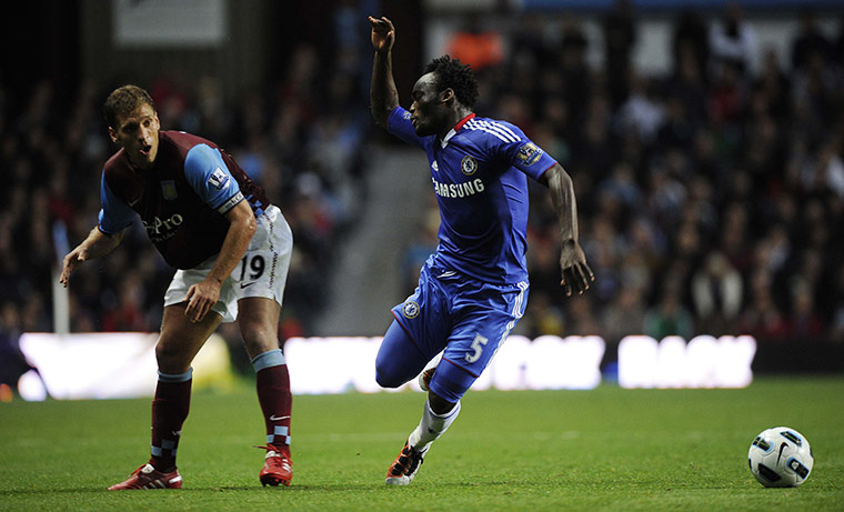 Aston Villa v Chelsea: Essien is tripped by Petrov