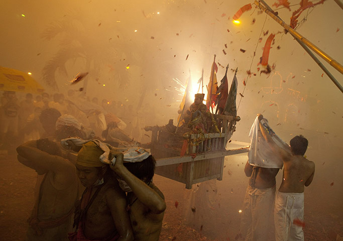 24 hours in pictures: Phuket, Thailand: Devotees of the Chinese shrine of Jui Tui