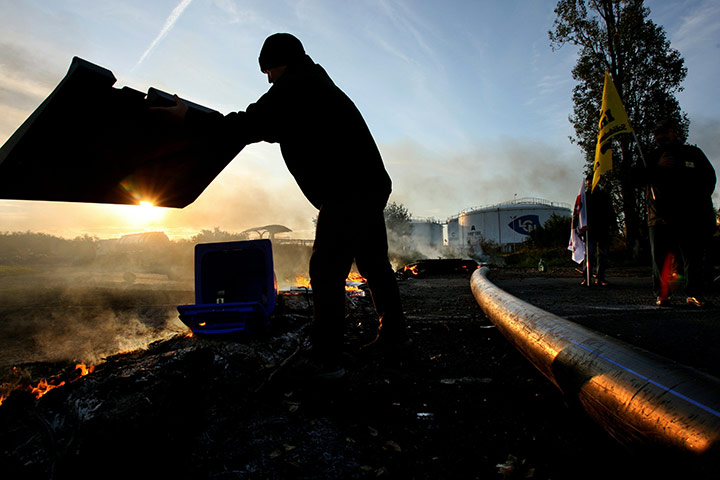 Fuel shortages in France: A man gestures as strikers block fuel storage depots in Caen