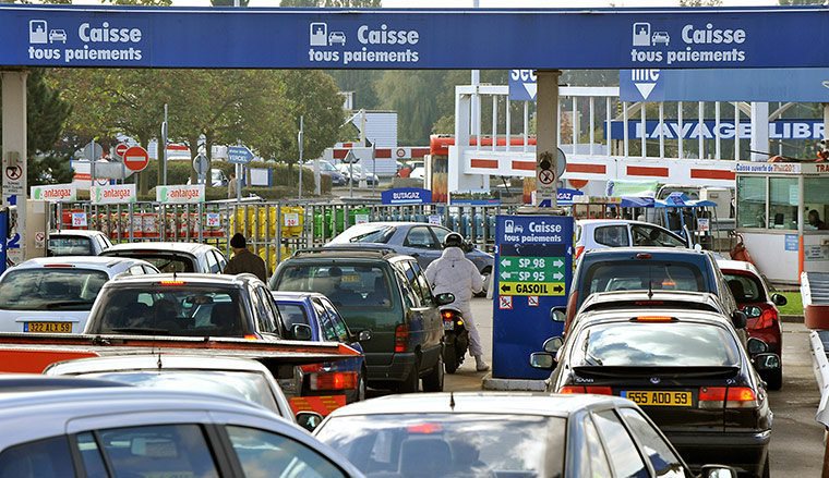 Fuel shortages in France: Car drivers queue to buy petrol in Wattignies, northern France