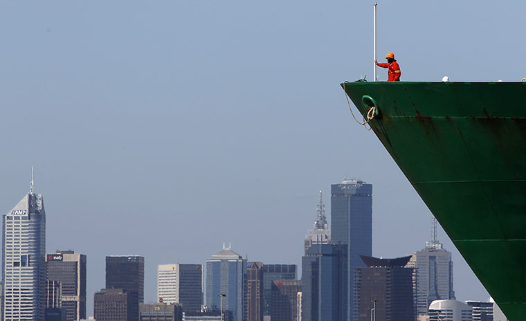 24 hours: Man is seen on the bow of a container ship in Melbourne