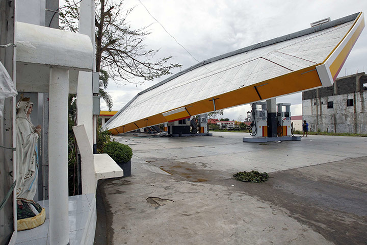 Typhoon Megi : A damaged canopy at a petrol station on the main road in Cauayan town