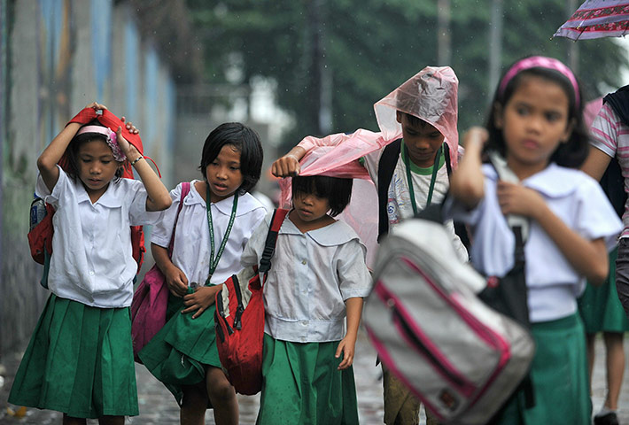 Typhoon Megi : Elementary students leave school after classes were suspended by weather