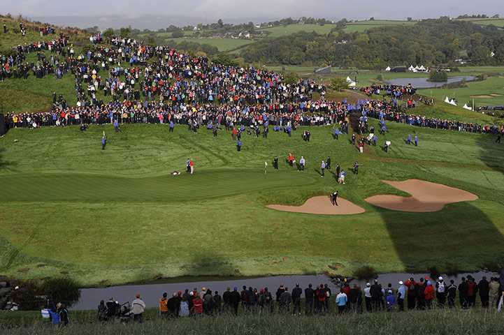 Ryder Cup Day 2: Graeme McDowell plays out of the bunker on the 15th