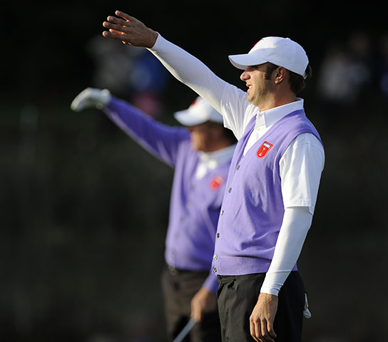 Ryder Cup Day 2: Dustin Johnson and Phil Mickelson shade their eyes from the rising sun