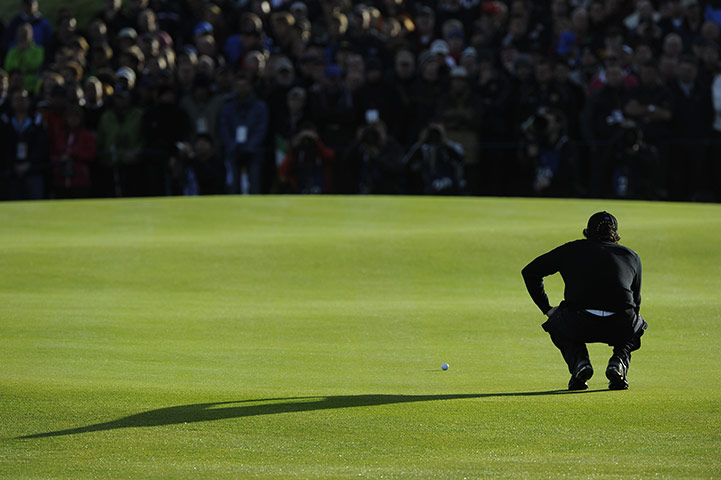 Ryder Cup Day 2: Rory McIlroy lines up a putt on the 14th green
