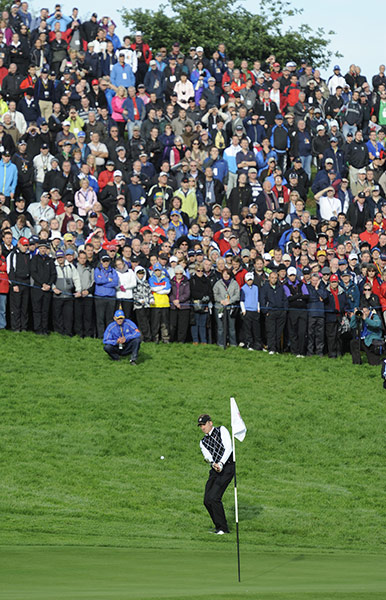 Ryder Cup Day 2: Ian Poulter chips onto the 15th green