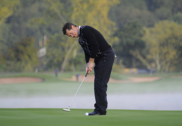 Ryder Cup Day 2: Lee Westwood putts on the 13th green 