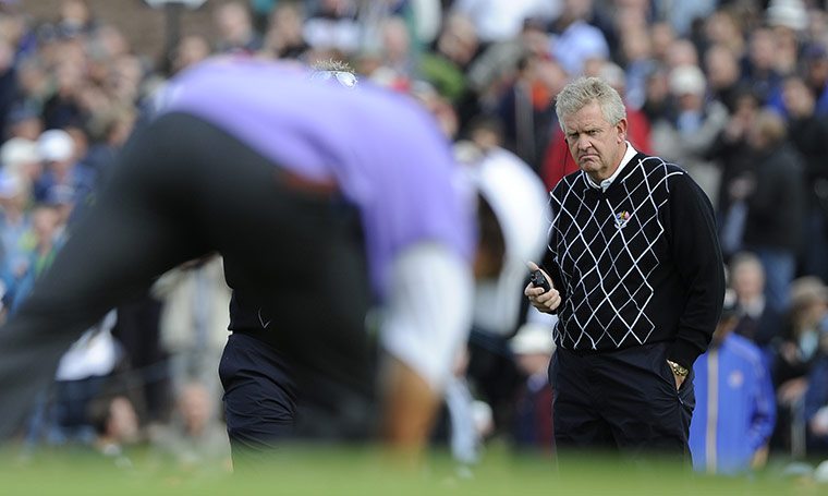 Day 2 Ryder Cup: Colin Montgomerie watches Ricky Fowler take his ball from the cup