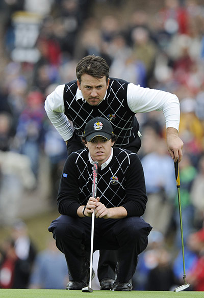 Day 2 Ryder Cup: Rory McIlroy lines up a small birdie putt on the 17th with Graeme McDowell