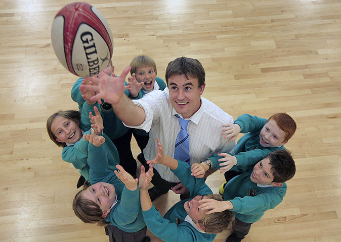Teaching Awards 2010: A teacher throws a ball in the air surrounded by pupils looking up