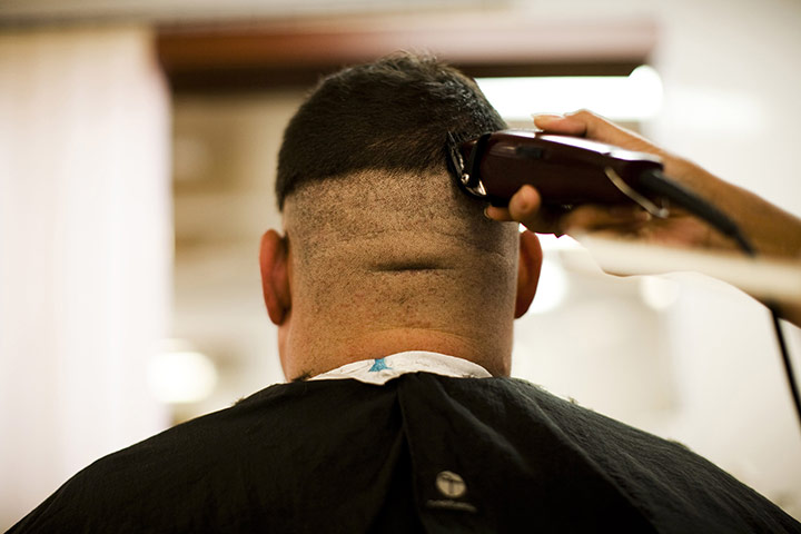 24 hours in pictures: US soldier gets a haircut at Kandahar Airfield 