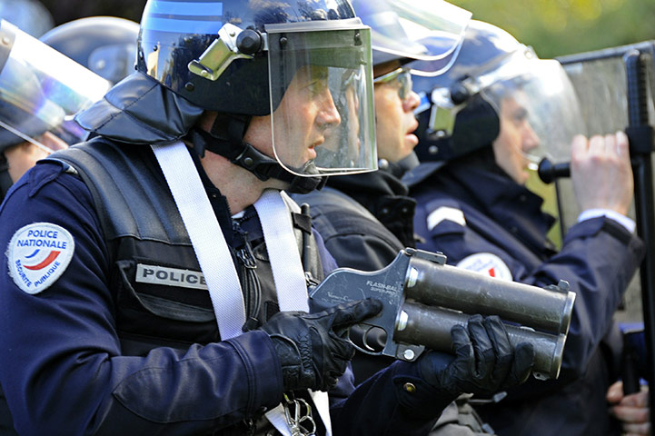 French strikes : An anti-riot policeman holds a Flash-Ball