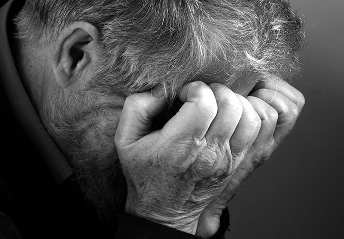 In pictures: moody: face covered by hands