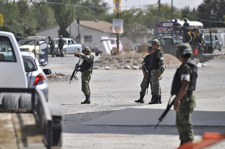 Marisol Valles: Soldiers man a checkpoint hours in the border town of Praxedis G. Guerrero