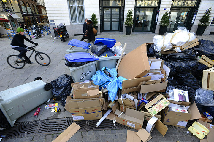 France Strike Update: People pass past piled up garbages in Nantes