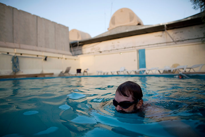 24 hours: A US State Department worker swims in Camp Nathan Smith, Afghanistan
