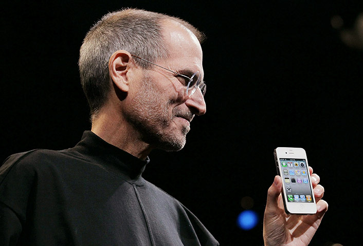 Week in Business: Apple CEO Steve Jobs holds the new iPhone 4