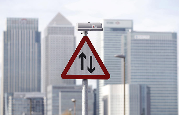 Week in Business: A traffic sign in the Canary Wharf financial district in London